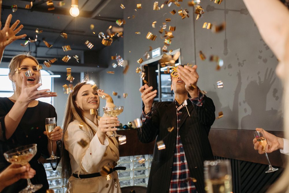 Gold confetti falling over a party